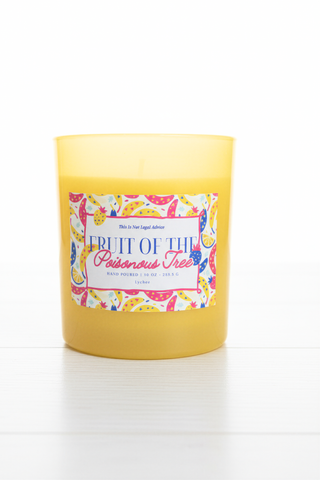 Yellow candle with a colorful label on a white background