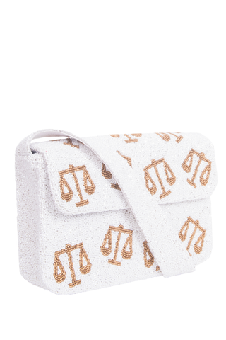 White Purse with gold scales of justice design on a white background