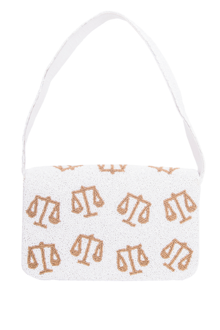 White bag with gold scales pattern on a white background