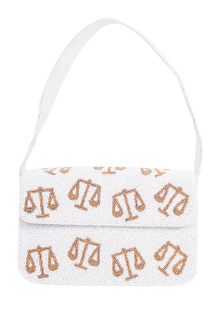Purse with gold scales pattern on a white background