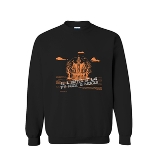 A black crewneck sweatshirt featuring an orange graphic of a haunted house, bare trees, clouds, and the text 'AS A MATTER OF LAW THE HOUSE IS HAUNTED' on the front, displayed against a solid white background.