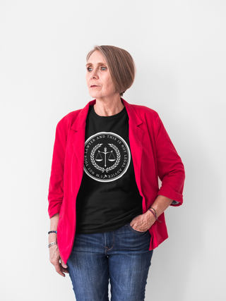 Woman wearing a red blazer over a black t-shirt with a logo on a white background
